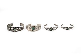 A group of Fred Harvey-style silver cuff bracelets