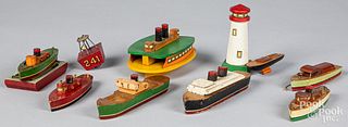 Group of wood Tillicum boats and a lighthouse