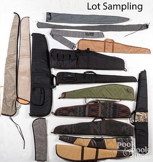 Large group of rifle and handgun cases.