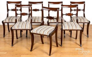 Set of seven Classical mahogany sabre leg chairs