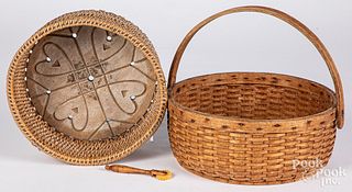 Two woven baskets, one with heart carved bottom