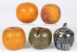 Five redware and ceramic fruit-form penny banks.