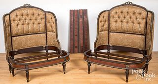 Pair of French mahogany and gilt beds