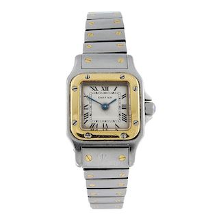 CARTIER - a Santos bracelet watch. Stainless steel case with yellow metal bezel. Reference 1057930,