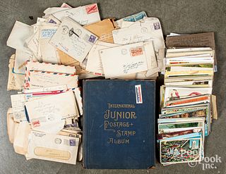 Group of vintage stamps and postcards.