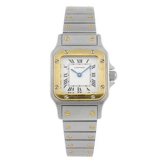 CARTIER - a Santos bracelet watch. Stainless steel case with yellow metal bezel. Reference 1567, ser