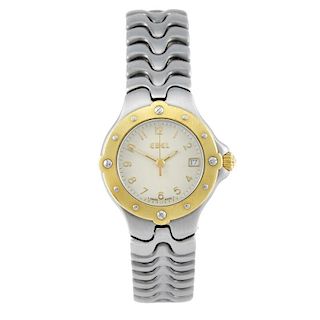 EBEL - a lady's Sportwave bracelet watch. Stainless steel case with yellow metal bezel. Reference E6