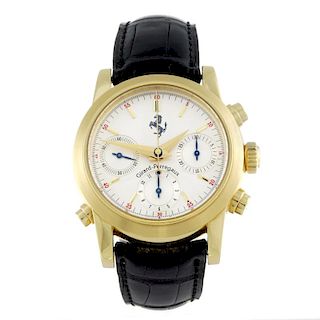 GIRARD-PERREGAUX - a gentleman's Ferrari Rattrapante chronograph wrist watch. Yellow metal case. Num