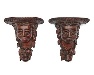 Pair of Continental Carved Walnut Figural Wall Brackets