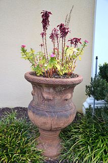Footed terracotta planter