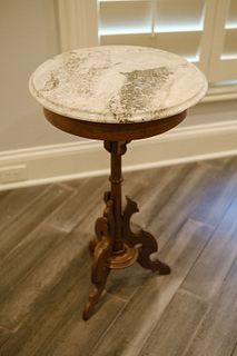 Victorian walnut candle stick table with a marbletop