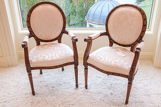Pair (2) of Louis XVI mahogany arm chairs covered in ivory damask