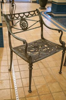 Set of (4) cast aluminum patio chairs with dolphin arms