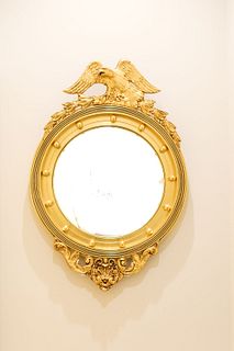 Gilt Federal style bullseye mirror with eagle and bellf lowers at top