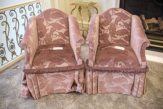Pair (2) of Camel back arm chairs with pleated skirts and rolled arms on casters w/brush fringed trim