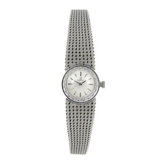 OMEGA - a lady's bracelet watch. White metal case, stamped 18K 0,750 with poincon. Numbered A87760 7