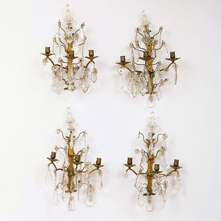 Group of Four Continental Gilt Metal, Rock Crystal and Glass Three-Light Wall Sconces