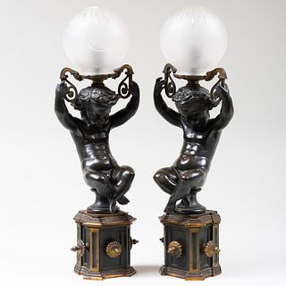Pair of Patinated Bronze Art Nouveau Figural Wall Lights with Glass Globes