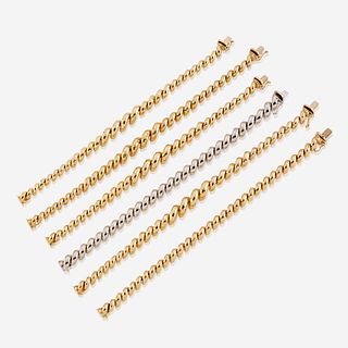 A collection of six fourteen karat gold bracelets