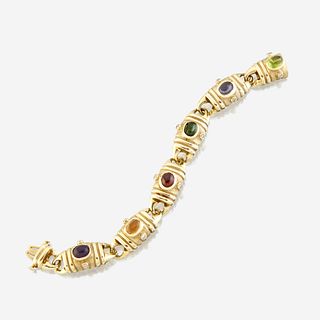 A fourteen karat gold and gem-set bracelet