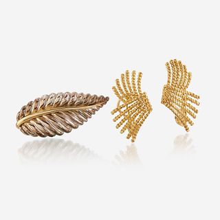 A pair of eighteen karat gold ear clips and a sterling silver and eighteen karat gold brooch, Tiffany & Co.