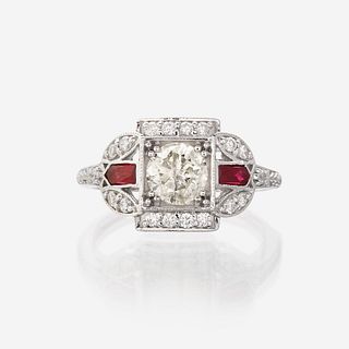 A diamond, ruby, and eighteen karat white gold ring