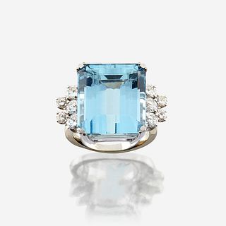 An aquamarine, diamond, and eighteen karat white gold ring