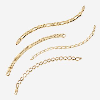 A collection of four fourteen karat gold bracelets