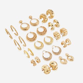 A collection of fourteen pairs of fourteen karat gold earrings