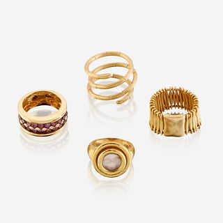 A collection of four eighteen karat gold rings