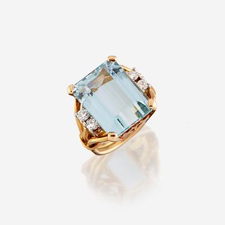 An aquamarine, diamond, and eighteen karat gold ring