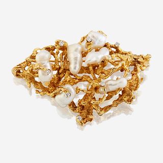 A fourteen karat gold, cultured pearl, and diamond brooch