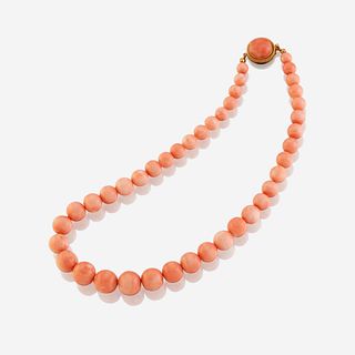 A coral and eighteen karat gold necklace