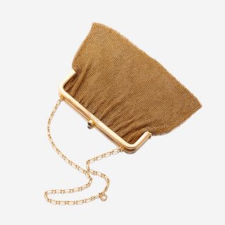 A fourteen karat gold mesh purse