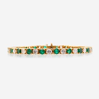 A diamond, emerald, and fourteen karat gold bracelet