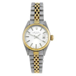 ROLEX - a lady's Oyster Perpetual Datejust bracelet watch. Circa 1974. Stainless steel case with yel