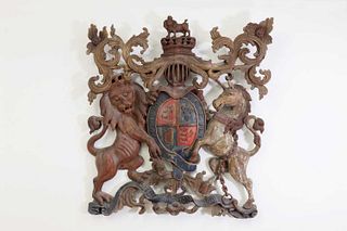 A large carved and polychrome painted Royal Coat of Arms of the United Kingdom,