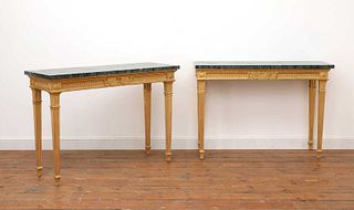 A pair of giltwood console tables in the manner of Robert Adam,
