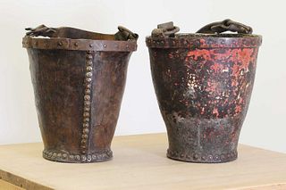 A near pair of leather fire buckets,