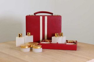 A red leather vanity case by Asprey London,