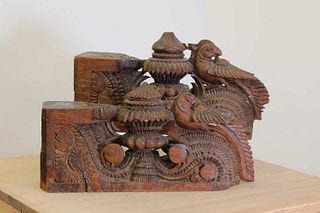 A pair of Indian carved teak corbels,