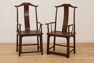 A pair of Chinese yokeback armchairs,