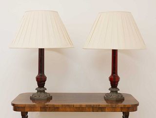 A pair of large red glass table lamps,