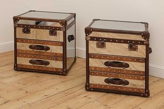 A pair of polished metal and leather aviator trunks,