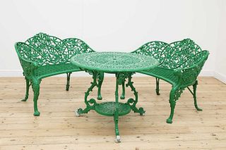 A pair of painted aluminium garden love seats in the manner of Coalbrookdale,