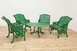 A set of four painted aluminium garden chairs in the manner of Coalbrookdale,