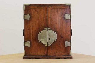 A small Chinese rosewood and paktong-mounted cabinet,