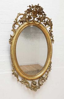 A rococo-style giltwood mirror,