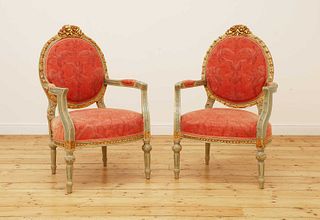 A pair of Louis XVI-style painted and parcel-gilt fauteuils,
