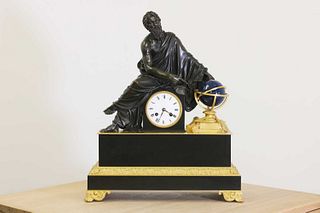 An Empire-style patinated and gilt-bronze mantel clock,